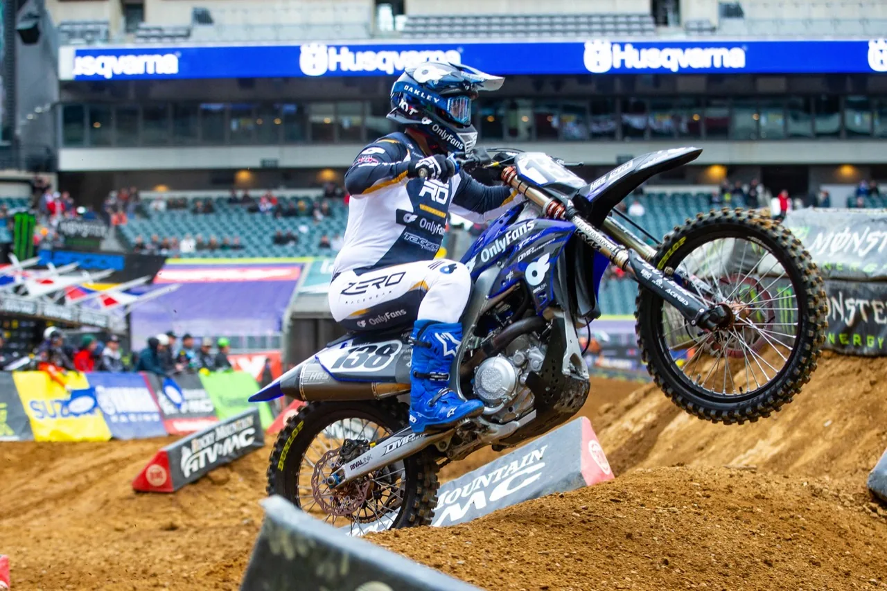 David Pulley Jr. riding a wheelie on his number 138 bike during stadium Supercross